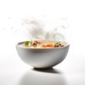 A bowl of delicious steaming vegetable soup. White isolated.