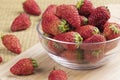 Bowl of delicious strawberries on a wooden background Royalty Free Stock Photo