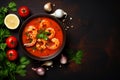 Bowl of delicious tomato soup with shrimps on the table, top view with copy space. AI generated Royalty Free Stock Photo