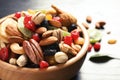 Bowl with different dried fruits and nuts on table Royalty Free Stock Photo