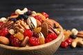 Bowl with different dried fruits and nuts on table Royalty Free Stock Photo