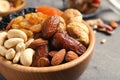 Bowl with different dried fruits and nuts on table Royalty Free Stock Photo