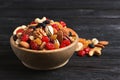 Bowl with different dried fruits and nuts on table. Royalty Free Stock Photo