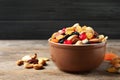 Bowl with different dried fruits and nuts on table Royalty Free Stock Photo