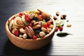 Bowl of different dried fruits and nuts on table. Royalty Free Stock Photo