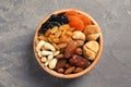 Bowl with different dried fruits and nuts on table Royalty Free Stock Photo