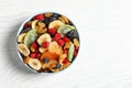 Bowl of different dried fruits on background, top view with space for text. Healthy lifestyle Royalty Free Stock Photo