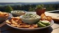 A bowl of dip with crackers and cucumber. Generative AI. Royalty Free Stock Photo