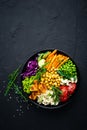 Bowl dish with brown rice, cucumber, tomato, green peas, red cabbage, chickpea, fresh lettuce salad and cashew nuts. Healthy balan Royalty Free Stock Photo