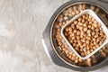 Bowl with dry chickpeas on table Royalty Free Stock Photo