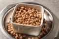 Bowl with dry chickpeas on table Royalty Free Stock Photo