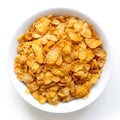 Bowl of dry cornflakes isolated on white. Royalty Free Stock Photo