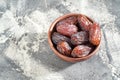 Bowl with dry dates. Top view. Healthy sweet snacks. Islamic turkish appetizer