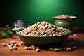 Bowl of dry dog food on a wooden table with green background Royalty Free Stock Photo