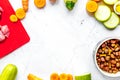 Bowl of dry dogfood, carrot, courgette, meat table background to Royalty Free Stock Photo