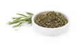 Bowl of dry tarragon and fresh leaves isolated on white Royalty Free Stock Photo