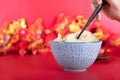 A bowl of dumplings and a pair of pre food chopsticks on a red background Royalty Free Stock Photo