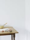 Bowl eggs and flour scattered on table