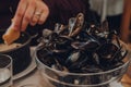 Bowl of empty mussels shells on a table in the restaurant in Brussels, Belgium