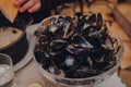 Bowl of empty mussels shells on a table in the restaurant in Brussels, Belgium