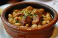 A bowl of fabada asturiana with white beans and pork Royalty Free Stock Photo