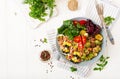 Bowl with Farfalle pasta, Brussels sprouts with bacon and fresh vegetable salad Royalty Free Stock Photo