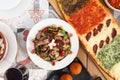 Bowl of Fattoush salad, with a variety of colorful ingredients and pita bread with zaatar
