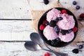 Field berry ice cream, above view table scene over a white wood background Royalty Free Stock Photo