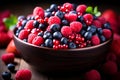 a bowl filled with blueberries raspberries and blackberries