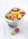 Bowl filled with colorful sweet candies in white ceramic bowl Royalty Free Stock Photo