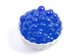 A Bowl Filled with Popping Boba on a White Background