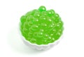 A Bowl Filled with Popping Boba on a White Background