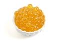 A Bowl Filled with Popping Boba on a White Background