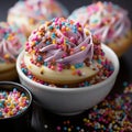 A bowl filled with rainbow sprinkles cupcakes, colorful and eye-catching, suitable for festive or culinary themes