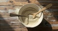 Bowl of fine powder with wooden spoons on rustic wooden surface Royalty Free Stock Photo