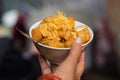 Bowl of finger - shaped soufle porridge on woman hand. Vietnamese food Royalty Free Stock Photo