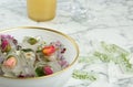 Bowl and floral ice cubes on table. Space for text Royalty Free Stock Photo