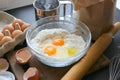 A bowl of flour and egg on the kitchen table Royalty Free Stock Photo