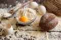 Bowl of flour with eggs and bread Royalty Free Stock Photo