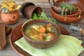 Bowl of forest mushroom soup with fried mushrooms, celery and parsley. Healthy food concept Royalty Free Stock Photo