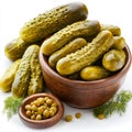 A bowl of fresh dill pickles with a small dish of capers Royalty Free Stock Photo