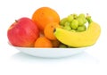 Bowl of fresh fruits isolated on white background with shadow reflection. Apple orange mandarin grape and banana in white bowl. Royalty Free Stock Photo