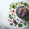 Bowl of fresh grapes with green leaves on white wooden table Royalty Free Stock Photo