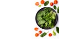Bowl of fresh green salad leaves, lettuce, spinach and red cherry tomatoes cuts Royalty Free Stock Photo