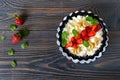 A bowl of fresh home-made cottage cheese with strawberries, mint and nuts Royalty Free Stock Photo