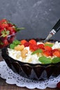 A bowl of fresh home-made cottage cheese with strawberries, mint and nuts Royalty Free Stock Photo