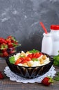 A bowl of fresh home-made cottage cheese with strawberries, mint and nuts Royalty Free Stock Photo