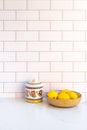 Bowl with fresh lemons on kitchen counter Royalty Free Stock Photo