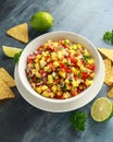 Bowl Of Fresh Mango Salsa With Nachos Chips And Herbs. Healthy Vegan, Vegetables Food.