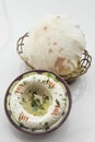 Bowl of fresh organic hummus lebanese food  on white table Royalty Free Stock Photo